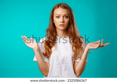 caucasian girl making do not know sign.