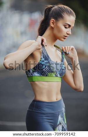 Similar – Slim figure shapely woman in sportswear