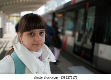 A Caucasian Girl Ten Years Old With Rucksack Waiting For A Tram In Rotterdam, The Netherlands, Lifestyle People, Traveler