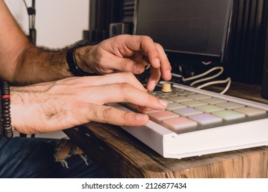 Caucasian Hands Using A Midi Controller In A Home Studio Making Urban Music Beat, Music Industry And Production Concept.