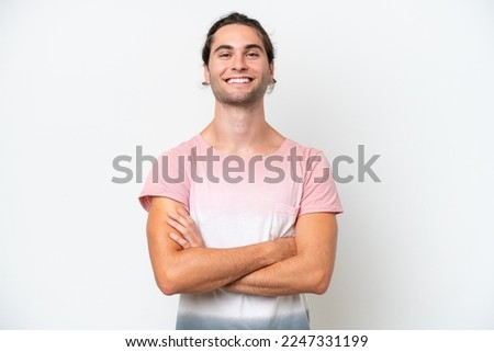 Caucasian handsome man isolated on white background keeping the arms crossed in frontal position