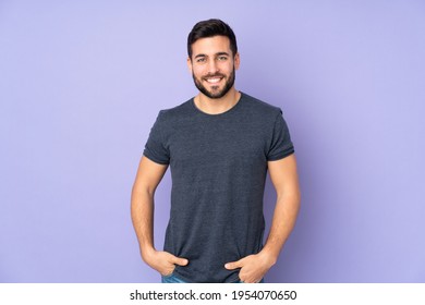 Caucasian handsome man laughing over isolated purple background - Powered by Shutterstock