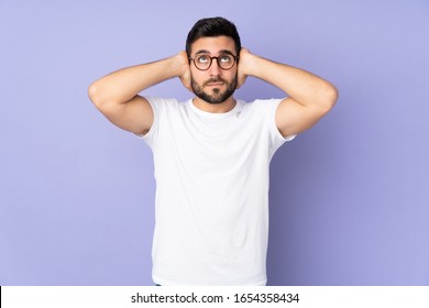 Caucasian handsome man over isolated background frustrated and covering ears - Shutterstock ID 1654358434