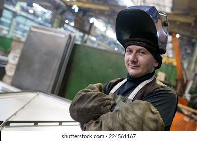 Caucasian industrial welder worker at factory workshop background - Powered by Shutterstock