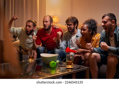 Caucasian joyful happy young friends woman and man at home hanging together cheering for favorite team and it winning match. People watching game on TV on sport channel, fun concept - Powered by Shutterstock