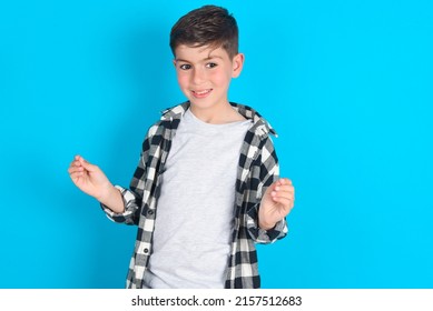 Caucasian Kid Boy Wearing Plaid Shirt Over Blue Background, Making Money Gesture.