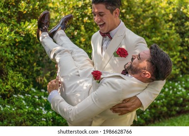 Caucasian LGBTQ Gay Couple Having Fun Together In Garden In Wedding Ceremony And Marriage Celebration. Concept Of Same Sex Relation