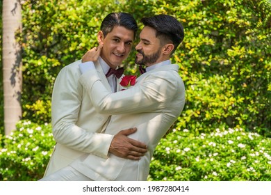 Caucasian LGBTQ Gay Couple Having Goodtime Dancing Together In Garden In Wedding Ceremony And Marriage Celebration. Concept Of LGBTQ Same Sex Relation