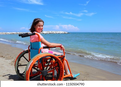 caucasian little girl on the wheelchair on summer by the sea - Powered by Shutterstock