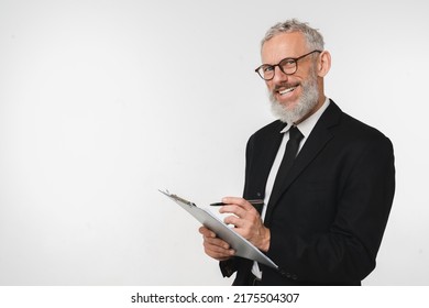 Caucasian Male Auditor Inspector Examiner Controller In Formal Wear Writing On Clipboard, Checking The Quality Of Goods And Service Looking At Camera Isolated In White Background