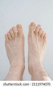 Caucasian Male Bare Feet. Close Up Shot, Isolated On White Background, Top View.