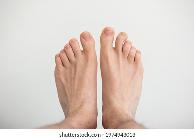 Caucasian Male Bare Feet Top View Close Up Shot Isolated On White.