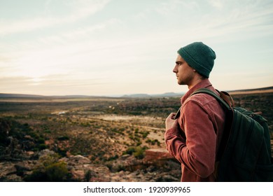 Caucasian Male Free Spirit Hiking In Wilderness With Backpack Embracing Outdoors