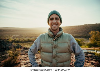 Caucasian Male Free Spirit Smiling While Enjoying Sunset Walking In Wilderness