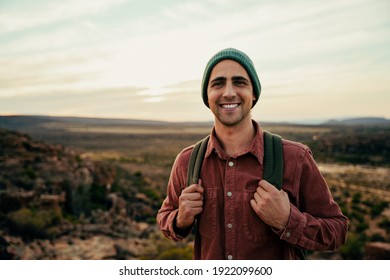 Caucasian Male Free Spirit Walking Through Wilderness With Backpack 