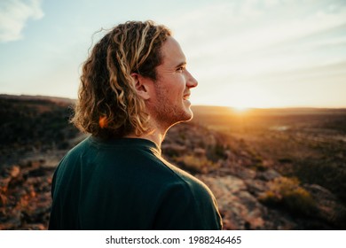 Caucasian Male Free Spirit Walking Through Wilderness At Sunrise Embracing Outdoors