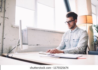 Caucasian Male Freelancer Working On Modern PC Computer Sitting At Desktop In Office, Male Student Learning Digital Marketing At Courses School Using Educational Programs. Occupation Of Administrative