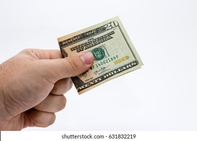  A Caucasian Male Hand Holding A 20 Dollar USA Note. 