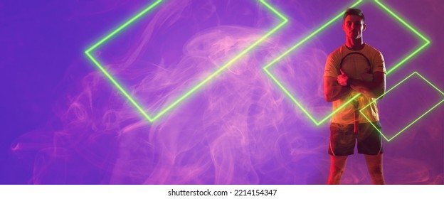 Caucasian male player holding tennis racket with illuminated rectangles against violet background. Copy space, digital composite, sport, competition, neon, glowing, smoke and abstract concept. - Powered by Shutterstock