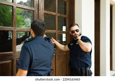 Caucasian Male Police Knocking On The Home Door With A Search Warrant To Do An Investigation And Look For Criminal Evidence