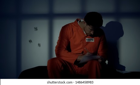 Caucasian Male Prisoner Writing Letter, Missing Family, Composing Mercy Petition