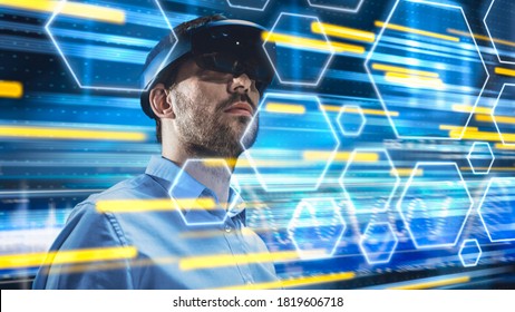 Caucasian Male IT Server Specialist Wearing Futuristic VR Helmet and Working in Data Center. Concept Shot with Cloud Server Hexahedron Icons and High-Speed Data Transfer Visualization in Foreground - Powered by Shutterstock