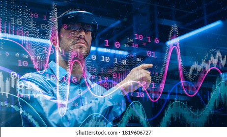 Caucasian Male IT Specialist and Businessman Wearing Futuristic VR Helmet and Working with Digital Data. Concept Shot of High Speed Internet Visualization and Graph Statistics in Foreground - Powered by Shutterstock