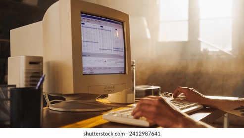 Caucasian Male Stock Trader Using Old Desktop Computer With Financial Candlestick Chart In Retro Garage. Man Analyzing Price Action Before Entering Trade, Starting Investment Fund In Nineties. - Powered by Shutterstock - Get 15% off with code: PIKWIZARD15