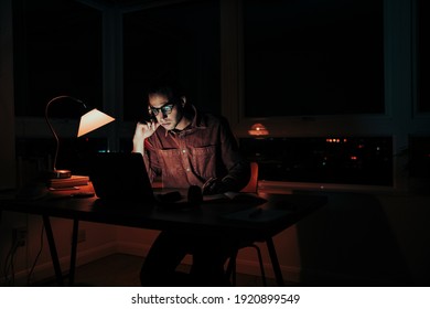 Caucasian Male Student Working Late At Night Stressed Meeting Deadlines Sitting At Home Workspace