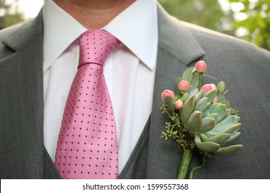 gray suit coral tie