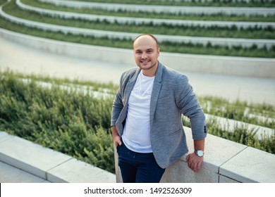 Caucasian Man 31 Years Old With A Bald Head And Beard In A Modern City Park