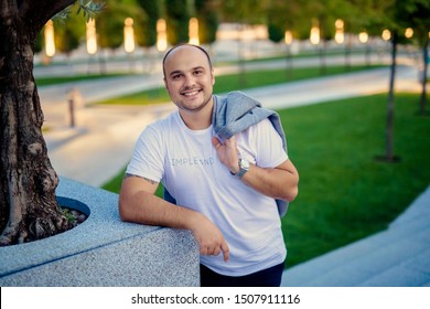 Caucasian Man 31 Years Old With A Bald Head And Beard In A Modern City Park