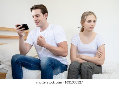 Caucasian Man Addicted To Phone And Not Interested In His Girlfriend. She Would Get Angry Very Unsightly. Couples Divorce
