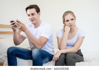 Caucasian Man Addicted To Phone And Not Interested In His Girlfriend. She Would Get Angry Very Unsightly. Couples Divorce
