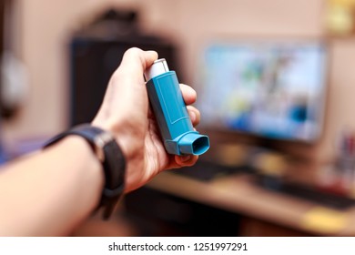 Caucasian Man With Asthma Spray In Hand At The Office. Asthma Attack At Office Work Concept.