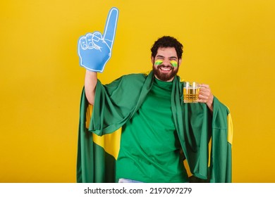 Caucasian Man With Beard, Brazilian, Soccer Fan From Brazil, Dancing And Partying While Having A Beer.