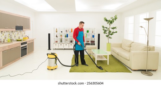 Caucasian Man Cleaning Carpet With Vacuum Cleaner In Living Room