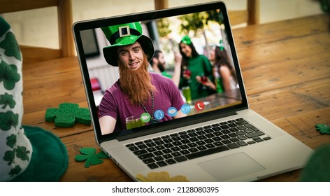 Caucasian man in costume making st patrick's day video call on laptop screen at home. fun during celebration of the irish patron saint's day. lockdown. - Powered by Shutterstock