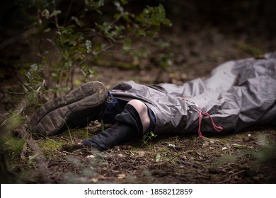 Caucasian Man Dead Body Lying On The Ground In The Woods. Murder In The Woods.