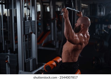 Caucasian man doing lat pull-downs on a machine. 