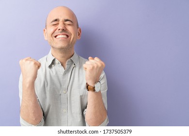 Caucasian Man With Eyes Closed And Clenched Jaw Being Hopeful And Wishing For Something Great To Happen