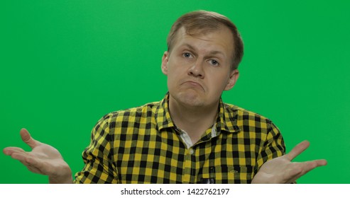 Caucasian man in glasses, doing gesture with hands like I don't know or whatever on the chroma key background. Green screen. - Powered by Shutterstock