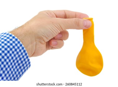 Caucasian Man Hand Holding A Yellow Deflated Balloon On White Background