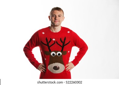 Caucasian Man With Hand On Hips Whilst Wearing A Christmas Jumper