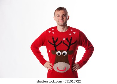 Caucasian Man With Hand On Hips Whilst Wearing A Christmas Jumper