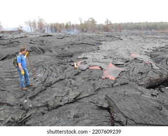 A Caucasian Man Hiking To A Lava River