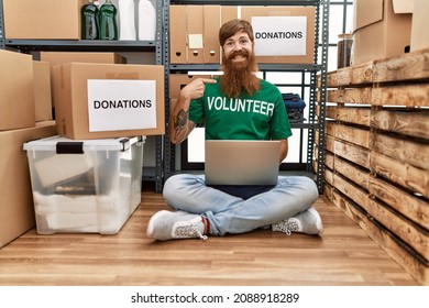 Caucasian Man With Long Beard Wearing Volunteer T Shirt Using Laptop Pointing Finger To One Self Smiling Happy And Proud 