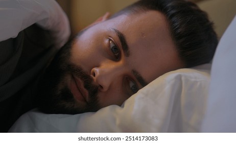 Caucasian man lying on bed trying sleep awake insomnia male guy late night bedroom home sleepless looking contemplation bedtime anxiety difficulty thinking disturbed sleeping problems worried medicine - Powered by Shutterstock