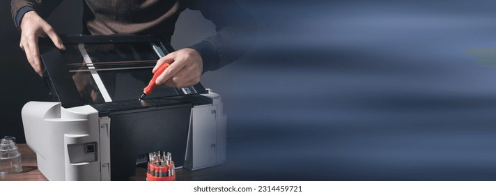 Caucasian man repairing digital printer.  - Powered by Shutterstock