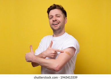 Caucasian Man Showing His Vaccinated Arm. He Received A Corona Vaccine Looking At Camera.